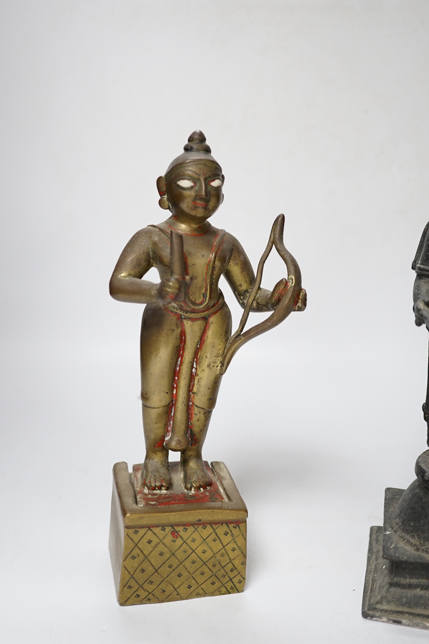 A 19th century Indian ‘Deepalakshni’ butter oil lamp and an 18th century Indian brass figure of Kodanda Rama (quiver of arrows lacking) tallest 26cm